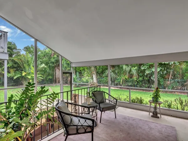 a view of a patio with a yard table and chairs