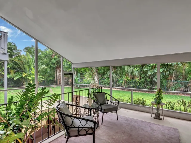 a view of a patio with a yard table and chairs