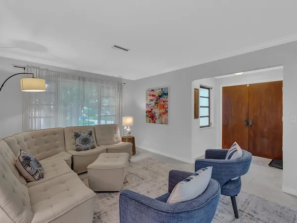 a living room with furniture and a window