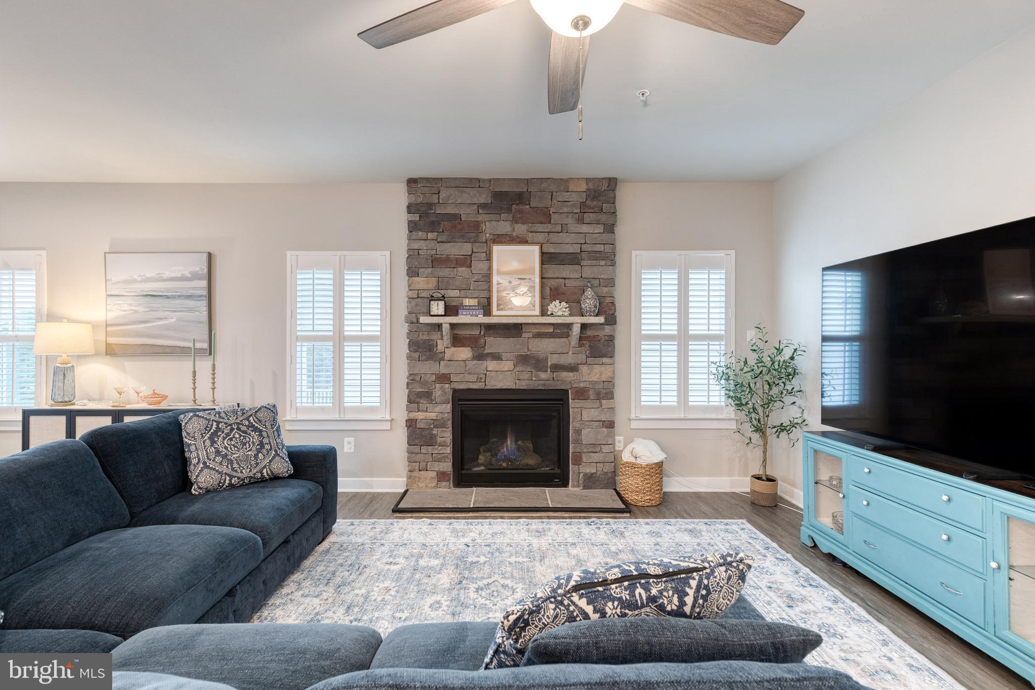 6003 Valentine Way Hanover, MD 21076 - Photo 7 of 52 a living room with furniture and a fireplace
