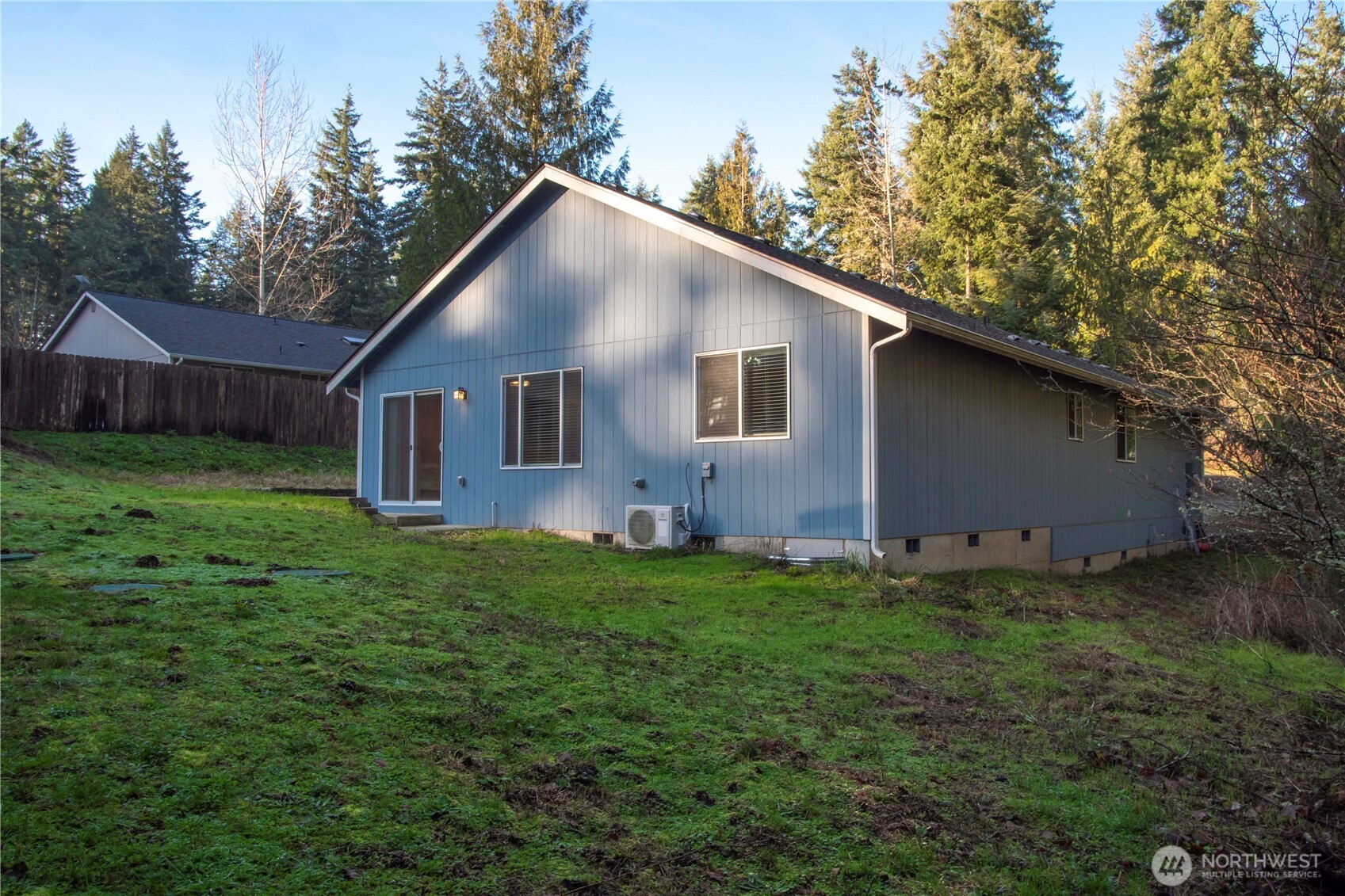 17643 Loop Lane Southeast Yelm, WA 98597 - Photo 29 of 34 a house is sitting in middle od the grass