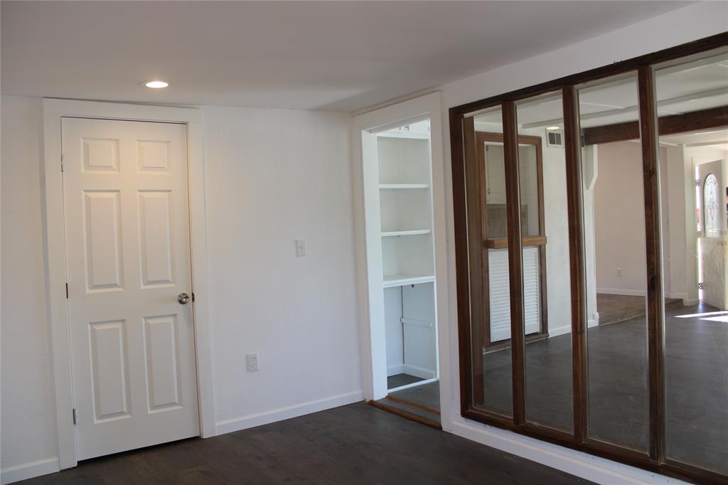 101 North 2 Nd Mullin, TX 76864 - Photo 15 of 34 a view of entryway with wooden floor