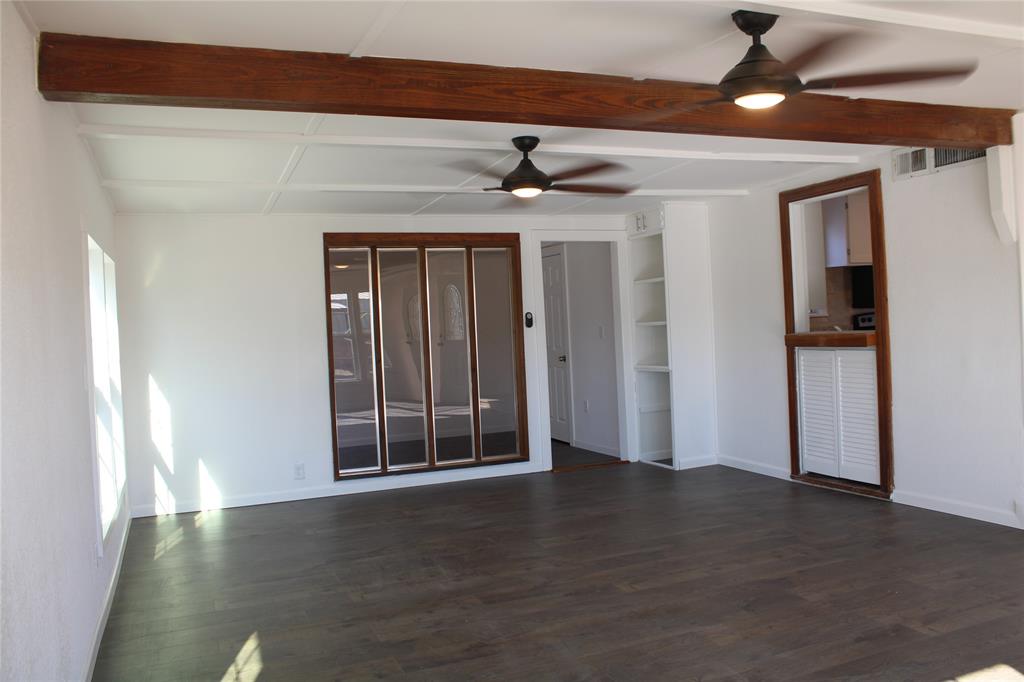 101 North 2 Nd Mullin, TX 76864 - Photo 4 of 34 a view of entryway with wooden floor
