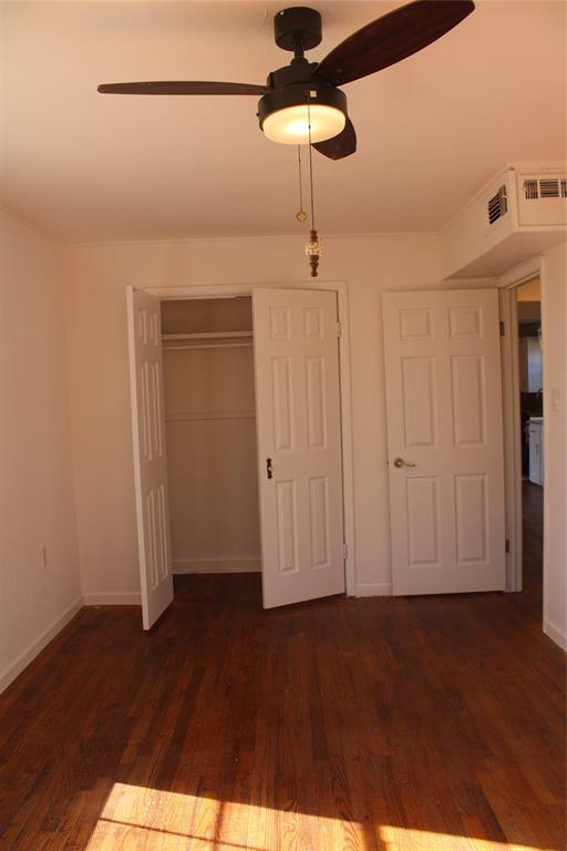 101 North 2 Nd Mullin, TX 76864 - Photo 7 of 34 a view of empty room with wooden floor