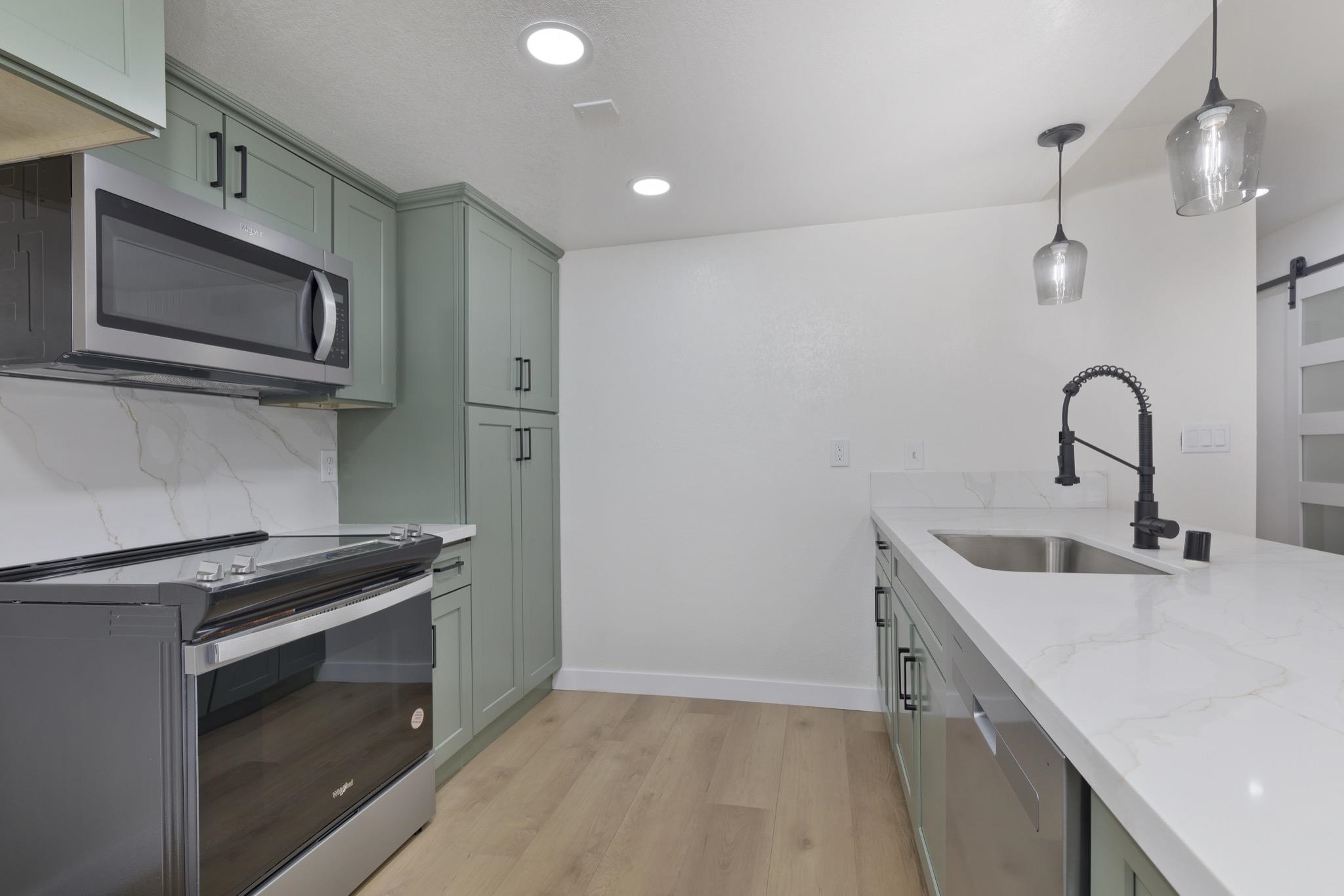 152 Viewpoint Road, Unit 105 Mammoth Lakes, CA 93546 - Photo 13 of 29 a kitchen with a sink and stainless steel appliances