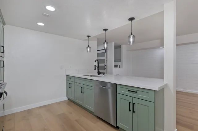 a bathroom with a double vanity sink and mirror