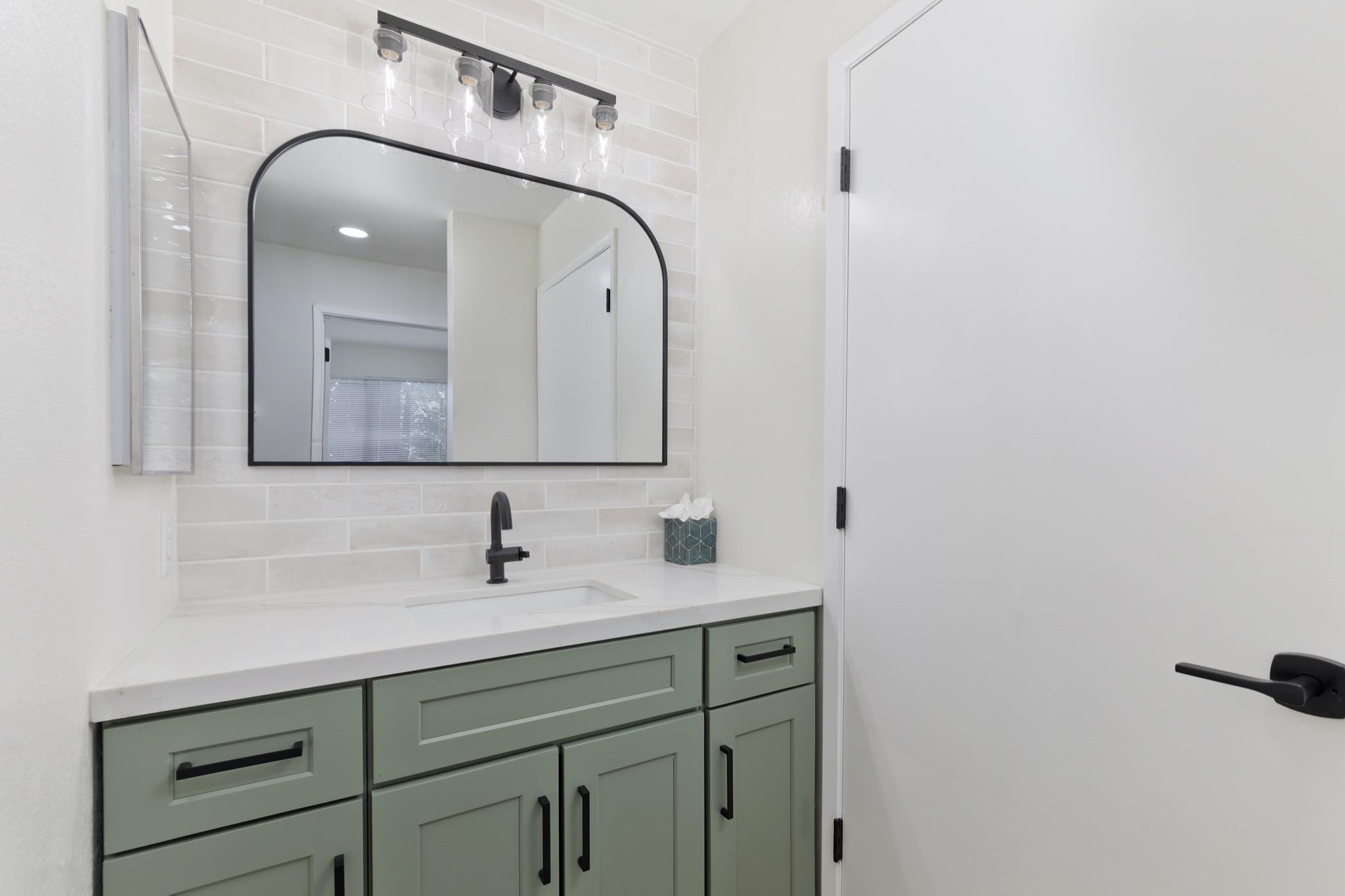 152 Viewpoint Road, Unit 105 Mammoth Lakes, CA 93546 - Photo 16 of 29 a bathroom with a double vanity sink and mirror