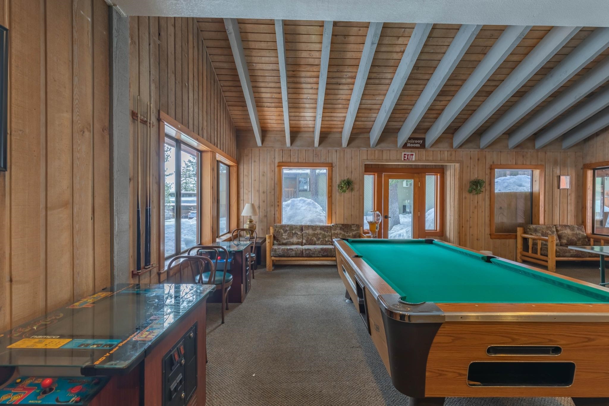 152 Viewpoint Road, Unit 105 Mammoth Lakes, CA 93546 - Photo 24 of 29 a room with pool table and windows
