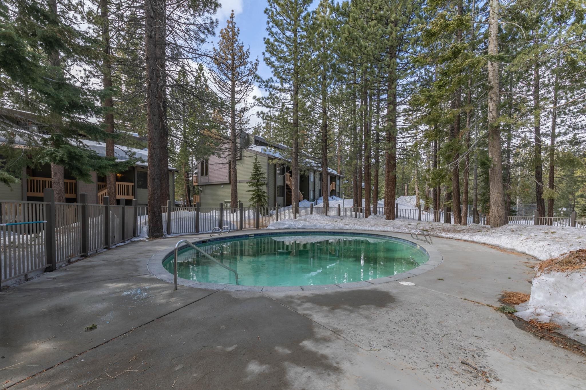 152 Viewpoint Road, Unit 105 Mammoth Lakes, CA 93546 - Photo 25 of 29 a swimming pool with outdoor seating and yard