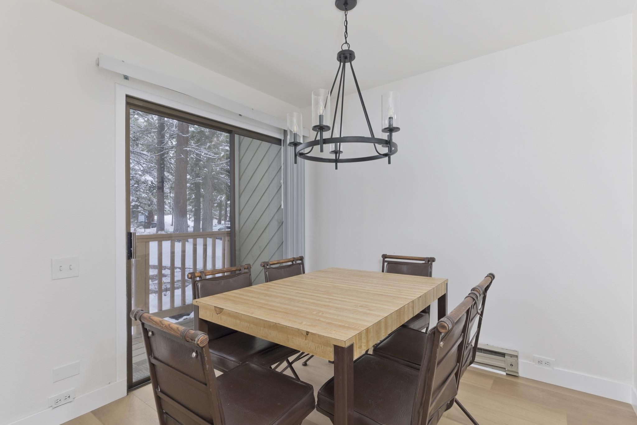 152 Viewpoint Road, Unit 105 Mammoth Lakes, CA 93546 - Photo 9 of 29 a view of a dining room with a table and chairs