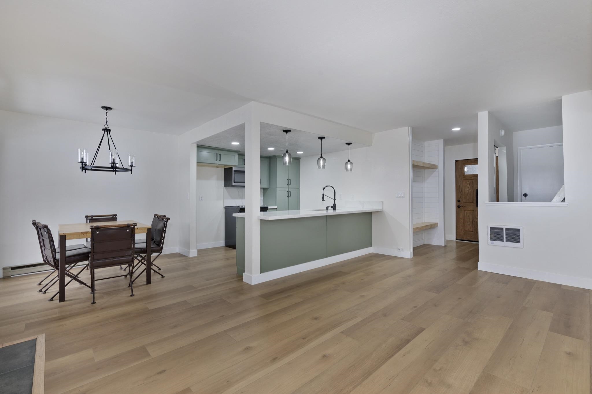 152 Viewpoint Road, Unit 105 Mammoth Lakes, CA 93546 - Photo 10 of 29 a view of a kitchen with furniture and wooden floor