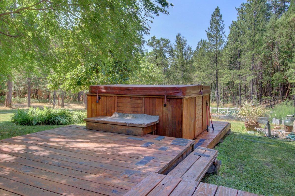 770 Hitching Post Road Grants Pass, OR 97526 - Photo 19 of 29 a backyard of a house with table and chairs