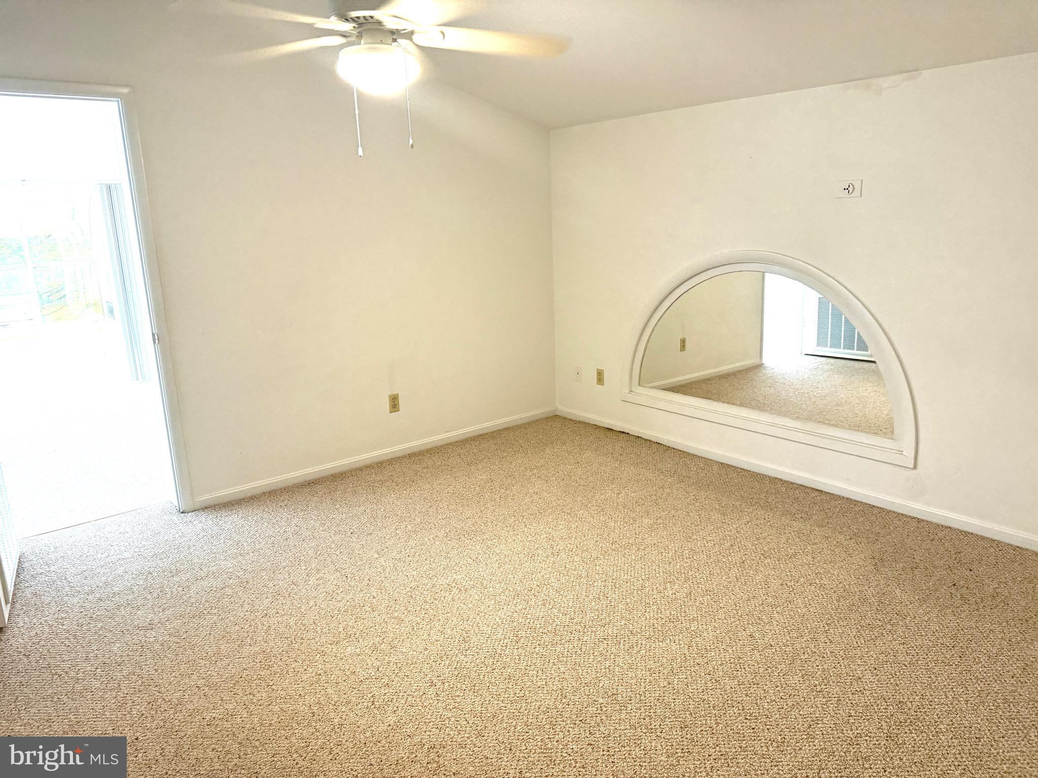 37 Hunters Point Millsboro, DE 19966 - Photo 25 of 38 an empty room with a ceiling fan and carpet