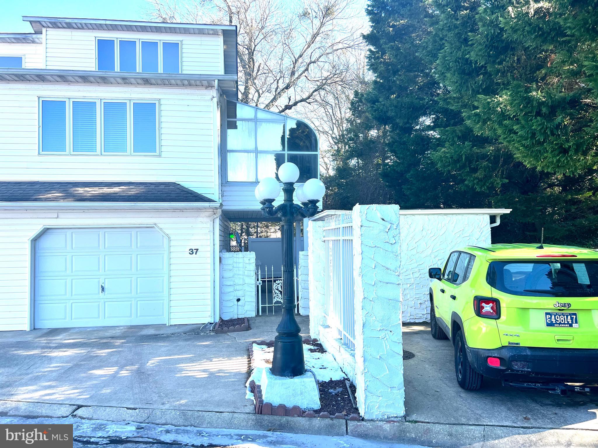 37 Hunters Point Millsboro, DE 19966 - Photo 3 of 38 a front view of a house with a garage and yard