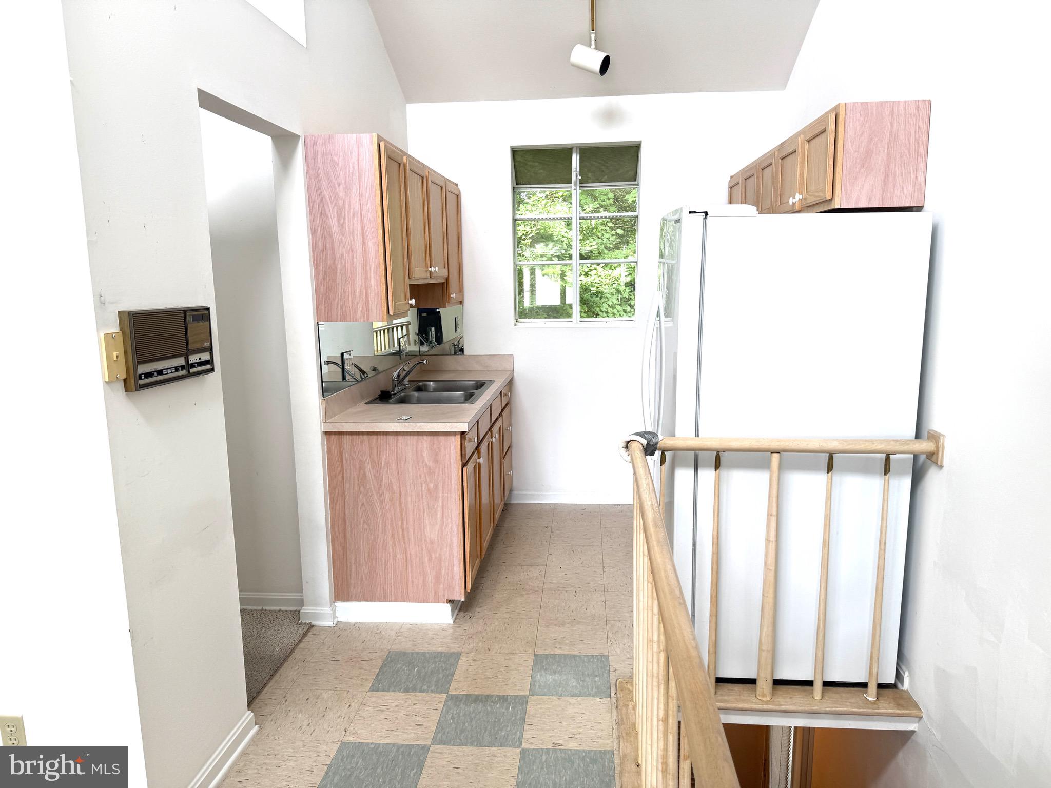 37 Hunters Point Millsboro, DE 19966 - Photo 34 of 38 a kitchen with a refrigerator and a sink