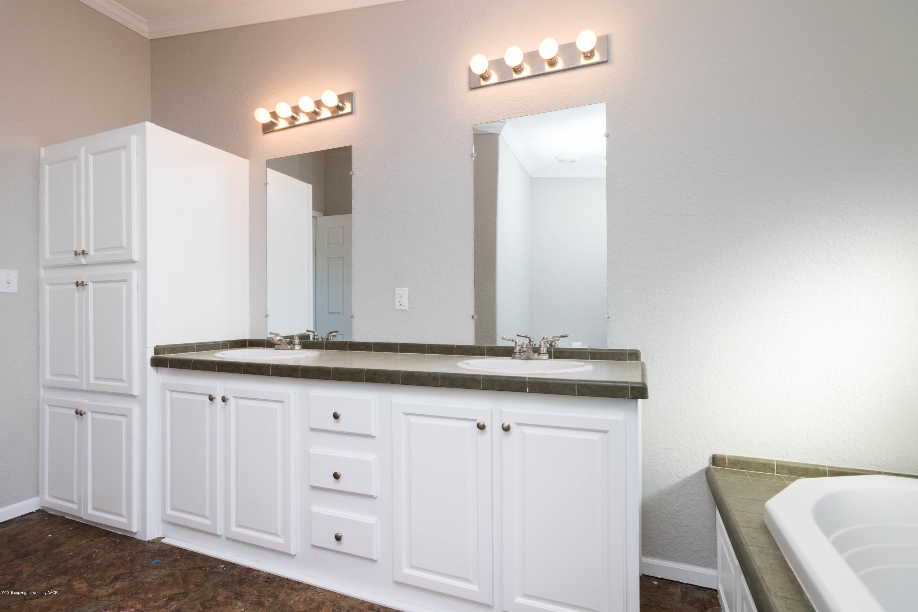 5015 Arden Road Amarillo, TX 79110 - Photo 18 of 38 a bathroom with a granite countertop sink and a mirror