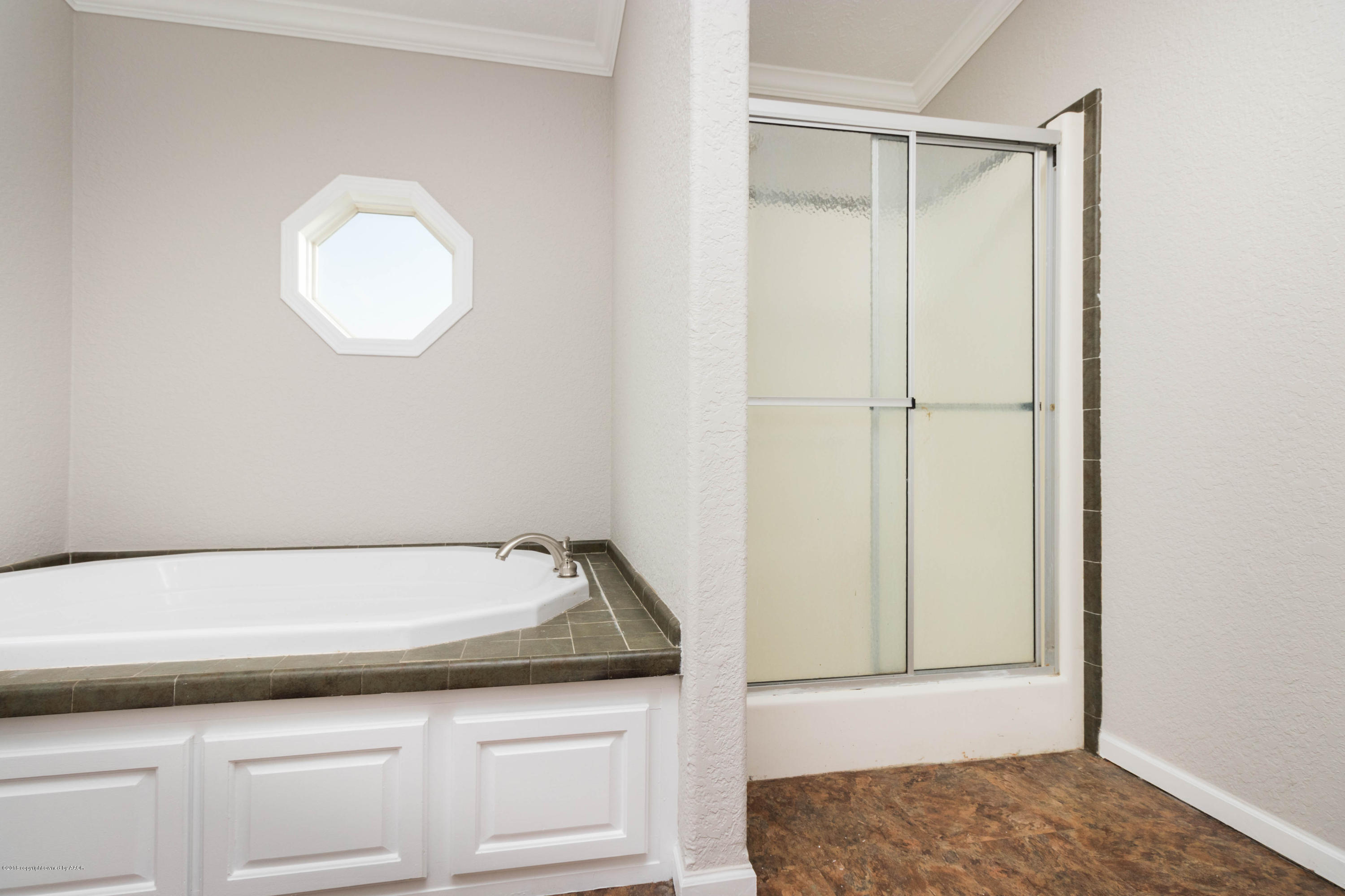 5015 Arden Road Amarillo, TX 79110 - Photo 20 of 38 a bathroom with a sink and a mirror