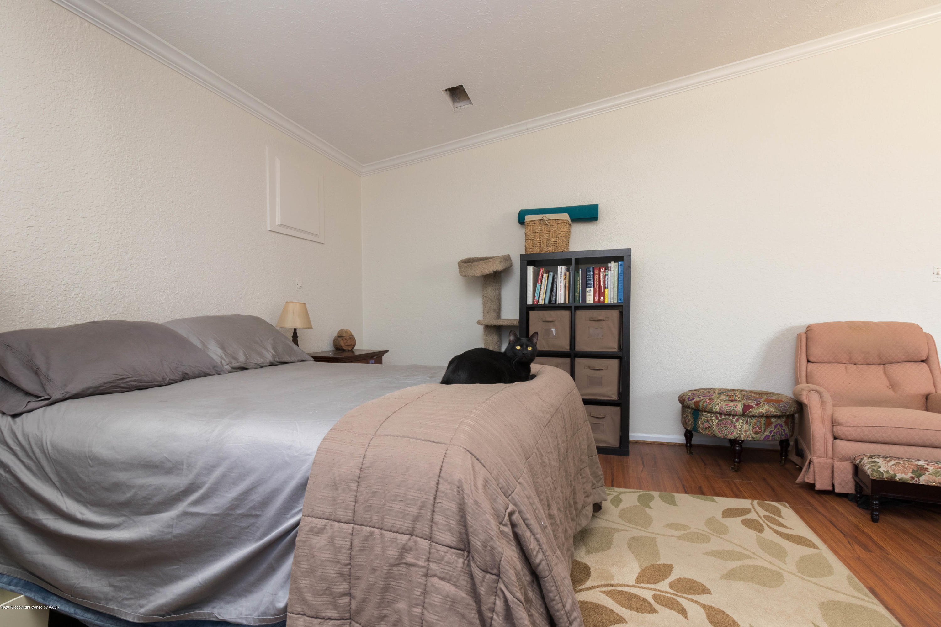 5015 Arden Road Amarillo, TX 79110 - Photo 27 of 38 a bedroom with a bed and a couch