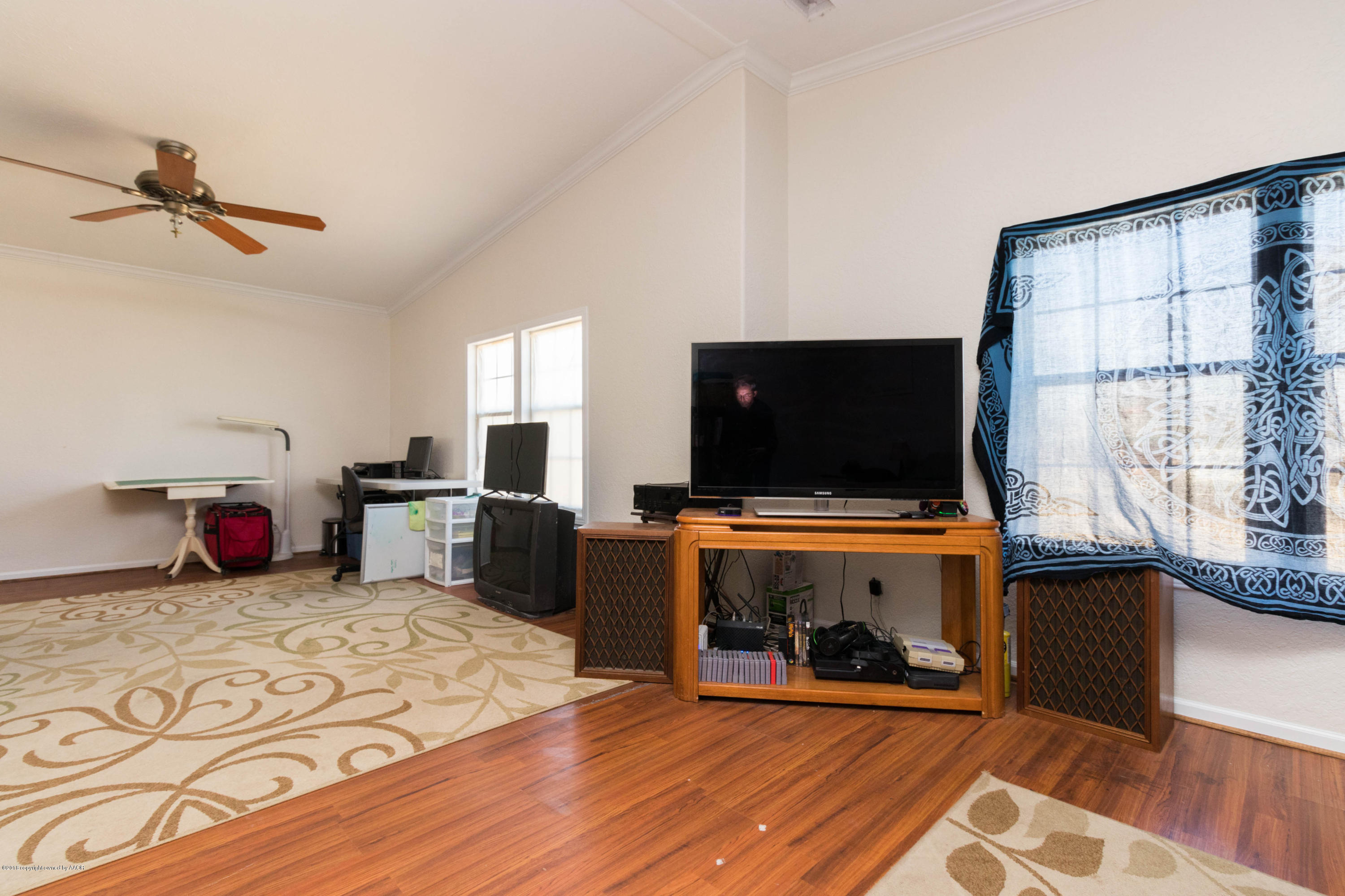 5015 Arden Road Amarillo, TX 79110 - Photo 28 of 38 a living room with furniture and a flat screen tv