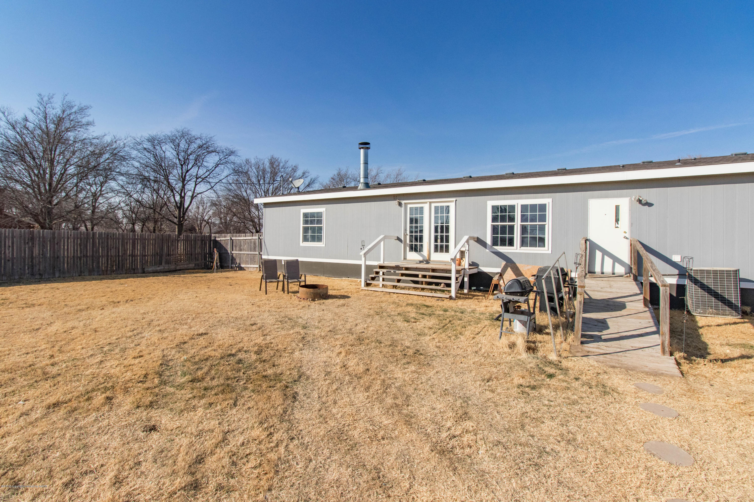 5015 Arden Road Amarillo, TX 79110 - Photo 32 of 38 a view of a house with backyard and patio