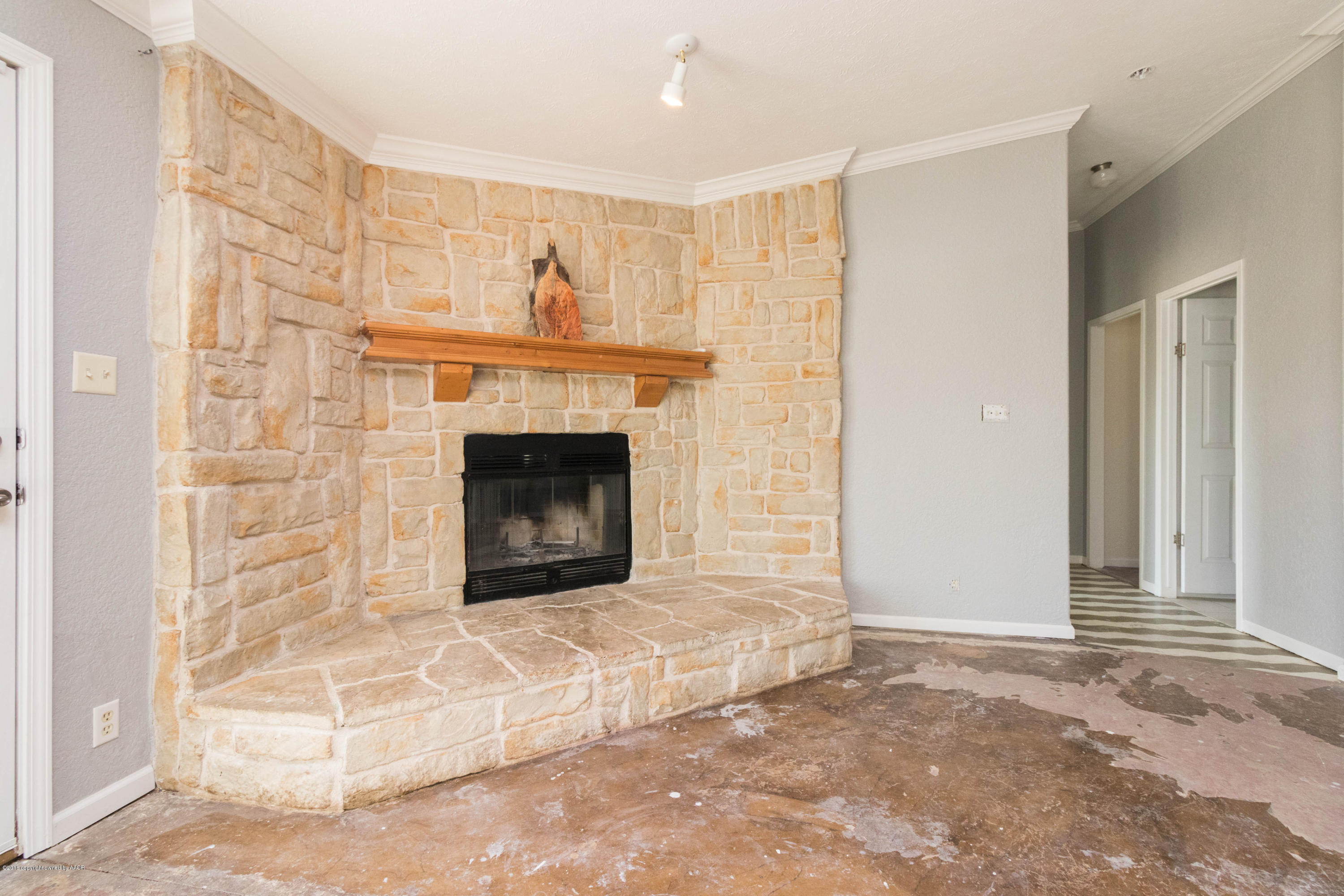 5015 Arden Road Amarillo, TX 79110 - Photo 7 of 38 a living room with a fireplace