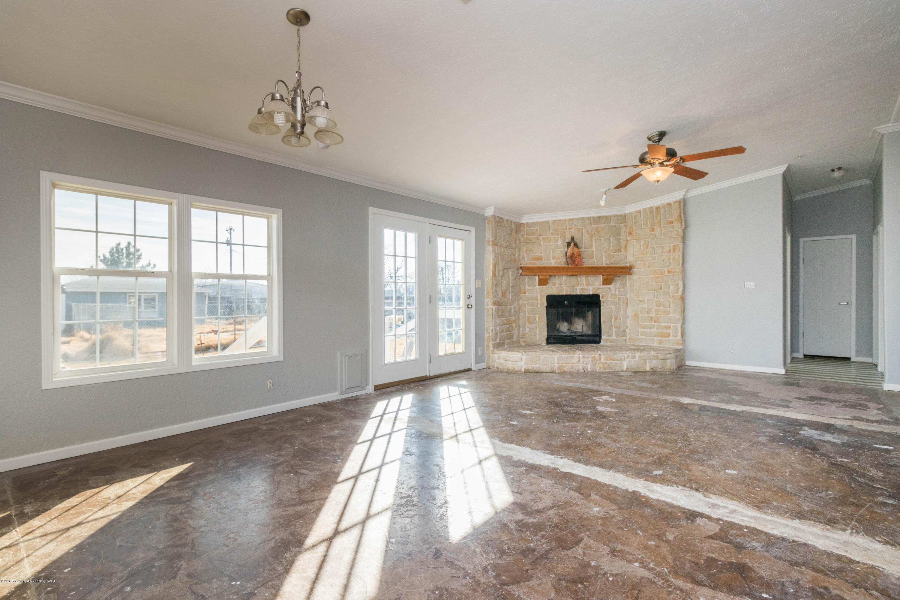 5015 Arden Road Amarillo, TX 79110 - Photo 8 of 38 a living room with furniture and a fireplace