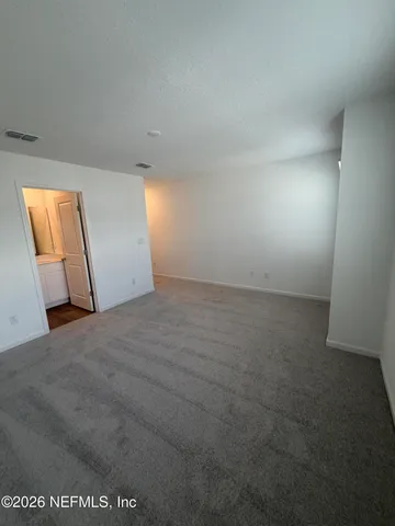 a bathroom with a shower a toilet and a sink
