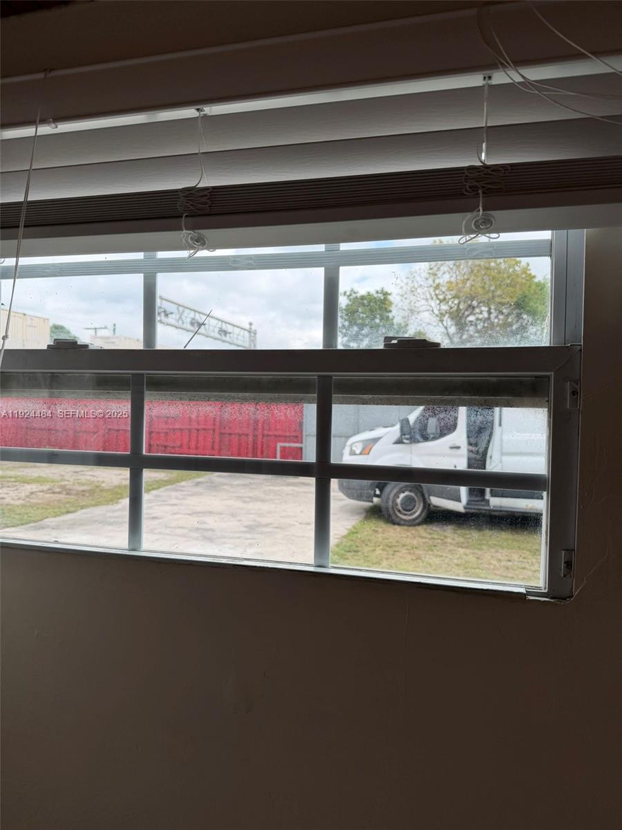 791 East 21st Street Hialeah, FL 33013 - Photo 11 of 19 a view of a living room and a fireplace