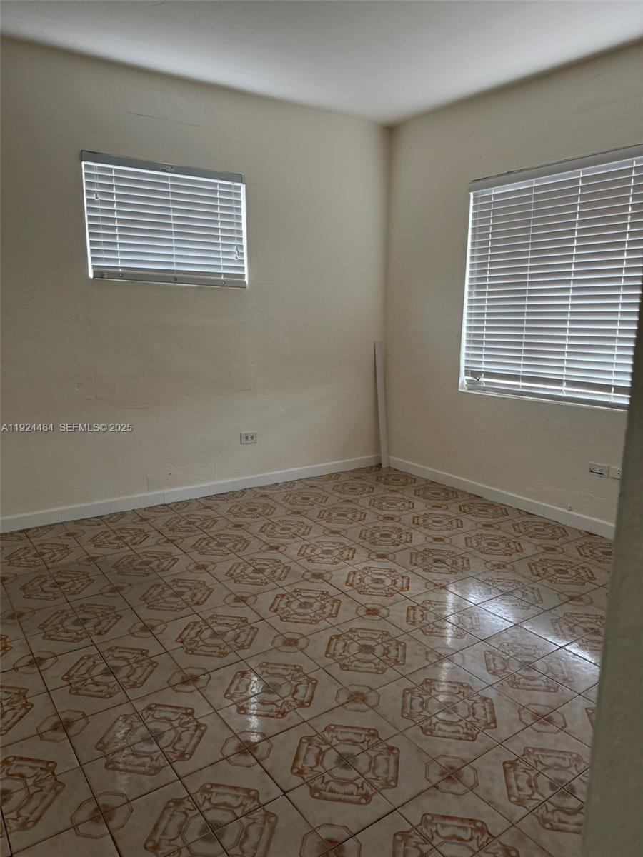 791 East 21st Street Hialeah, FL 33013 - Photo 15 of 19 a view of an empty room with a window