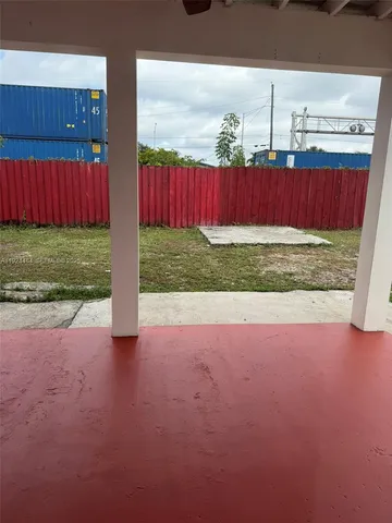 a view of backyard with tub