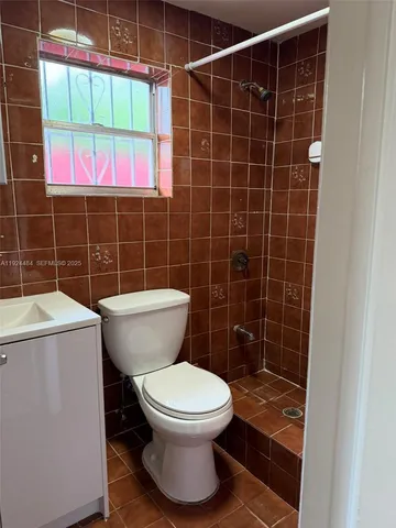 a bathroom with a toilet and a sink