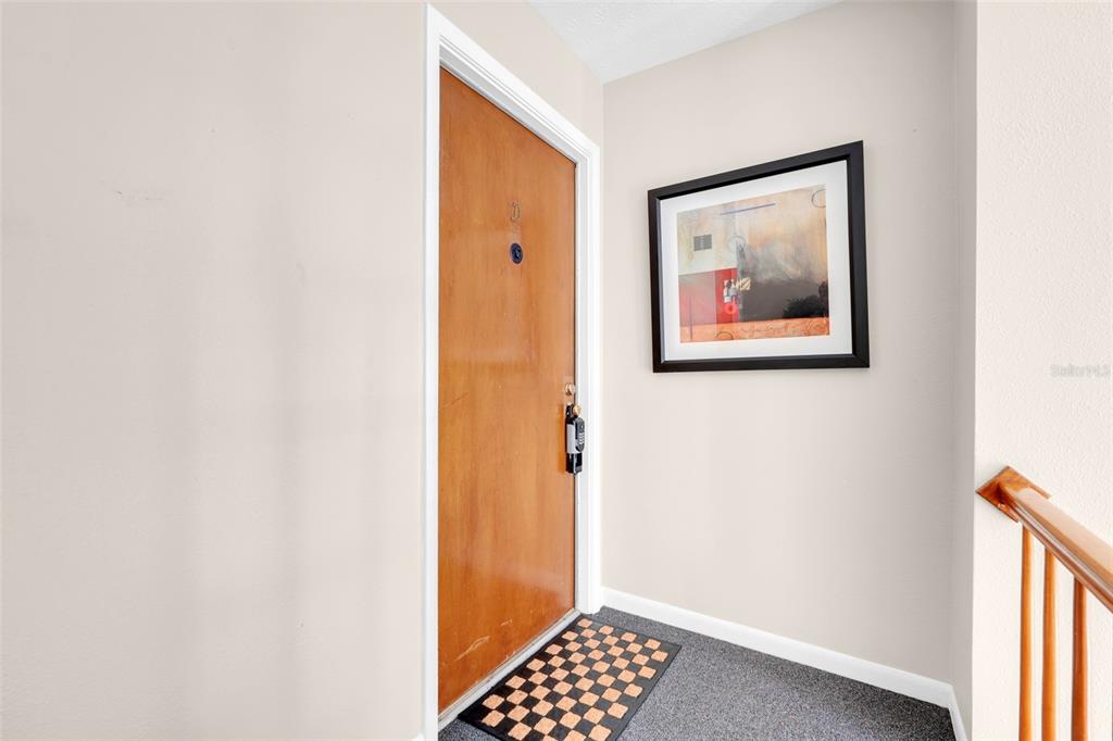 4224 Lake Underhill Road, Unit 8B8 Orlando, FL 32803 - Photo 11 of 47 a view of a bedroom with a hallway