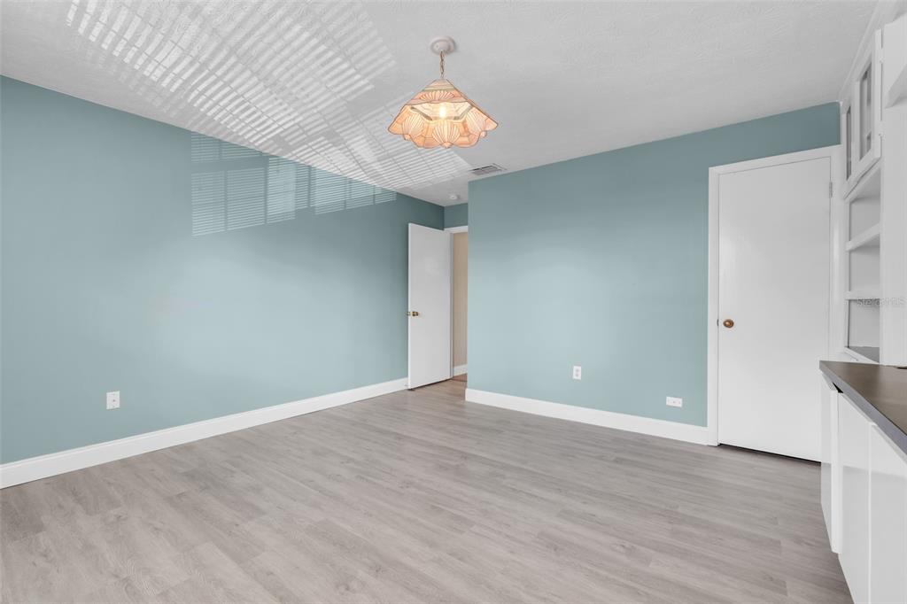 4224 Lake Underhill Road, Unit 8B8 Orlando, FL 32803 - Photo 25 of 47 wooden floor in an empty room with a window
