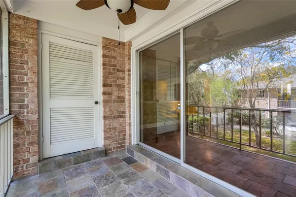 a view of porch with a door