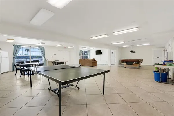a kitchen with a table chairs and a dining table