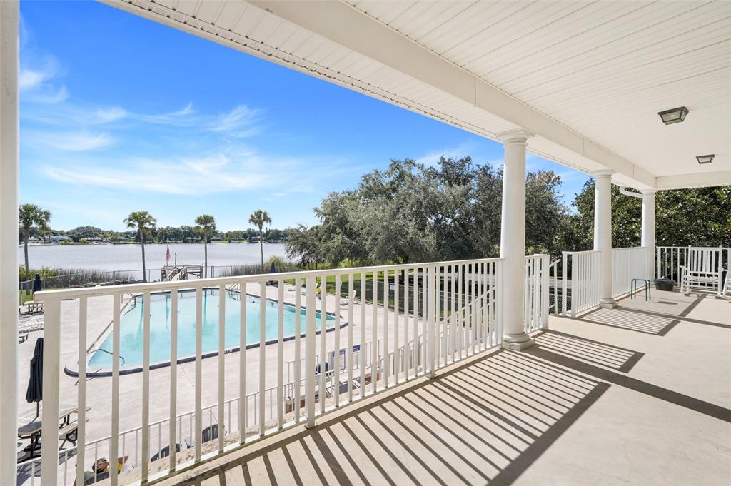 4224 Lake Underhill Road, Unit 8B8 Orlando, FL 32803 - Photo 43 of 47 a view of balcony with wooden floor and fence