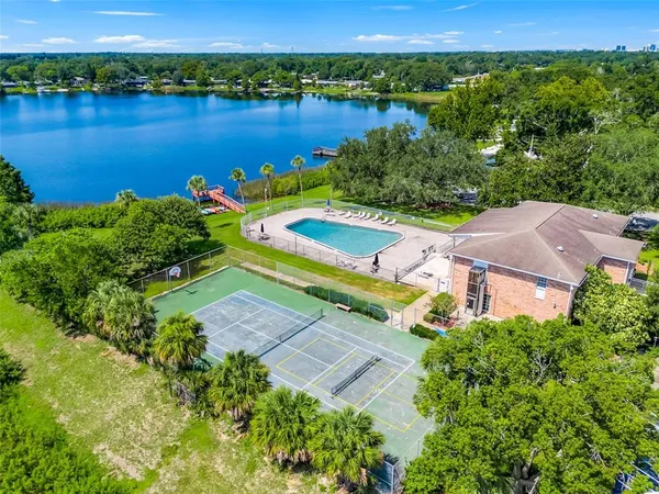an aerial view of a house with a lake view