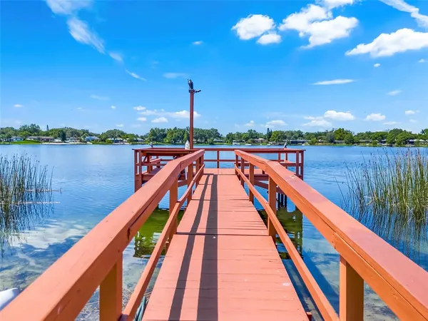 a view of sitting space next to a lake
