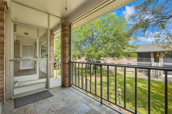 a view of a balcony with an outdoor space