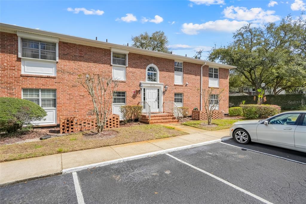 4224 Lake Underhill Road, Unit 8B8 Orlando, FL 32803 - Photo 9 of 47 a view of a that has a parked car