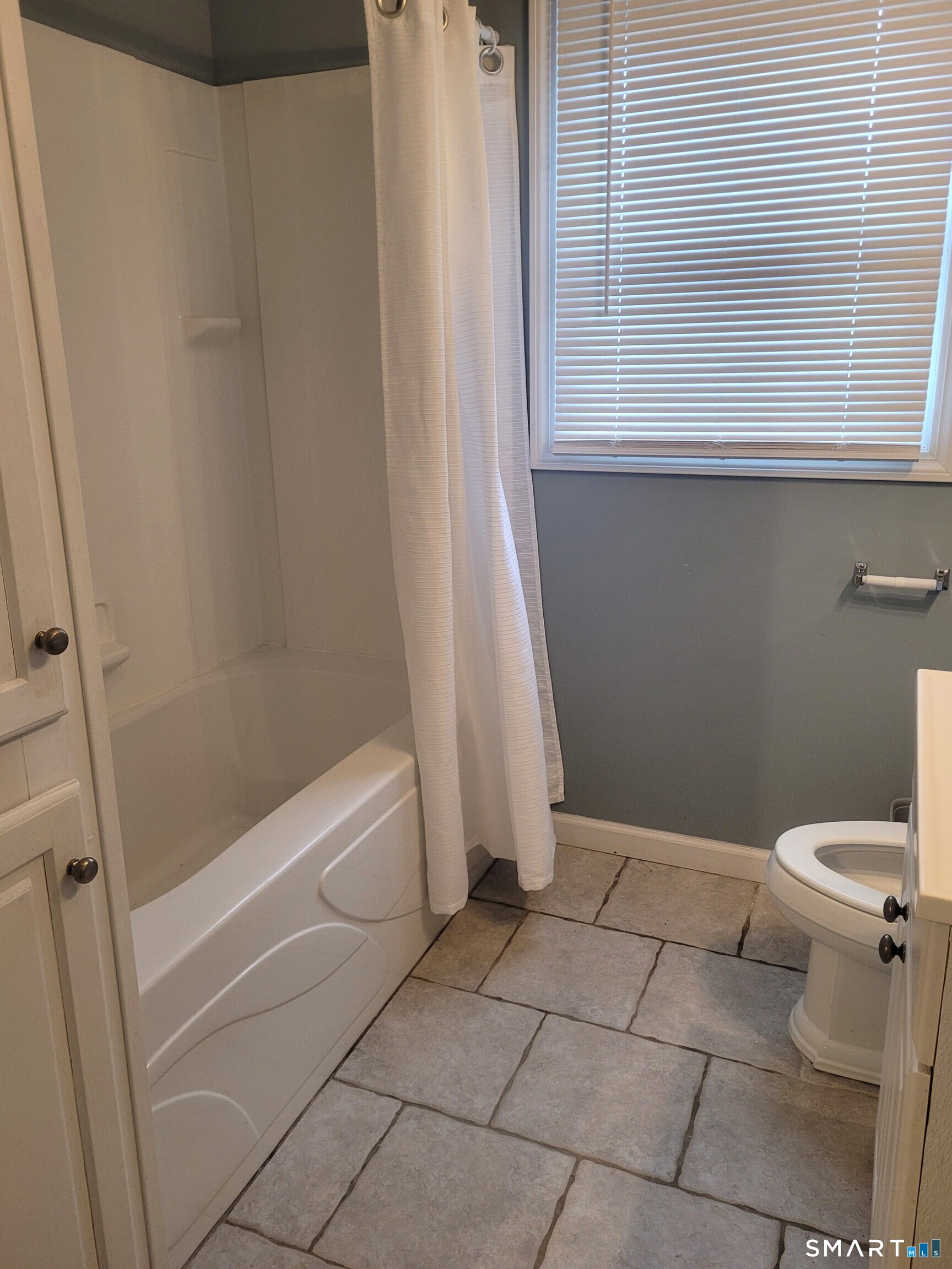 123 Bridge Street Groton, CT 06340 - Photo 15 of 22 a bathroom with a toilet and a shower