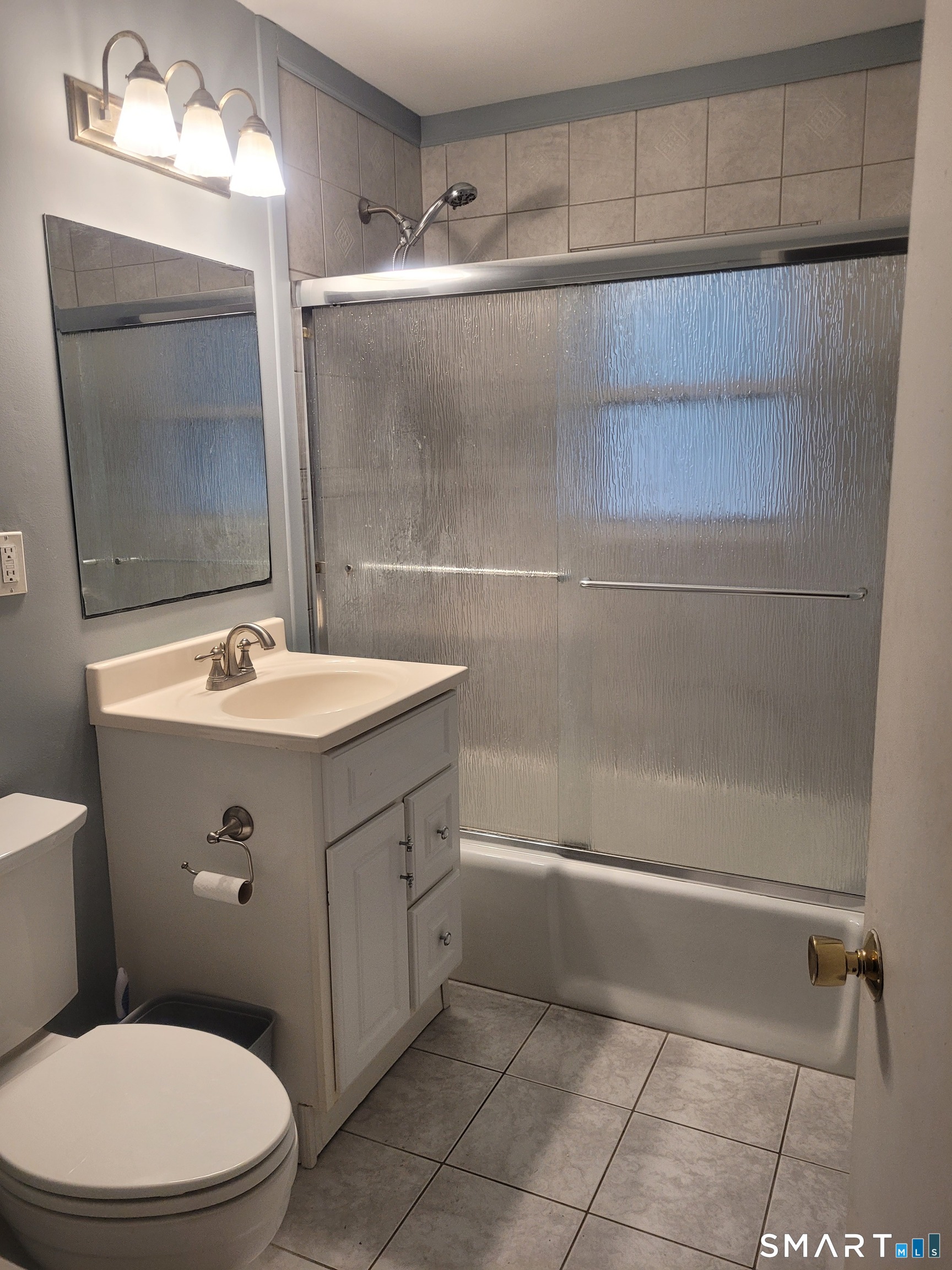 123 Bridge Street Groton, CT 06340 - Photo 19 of 22 a bathroom with a sink a toilet and shower