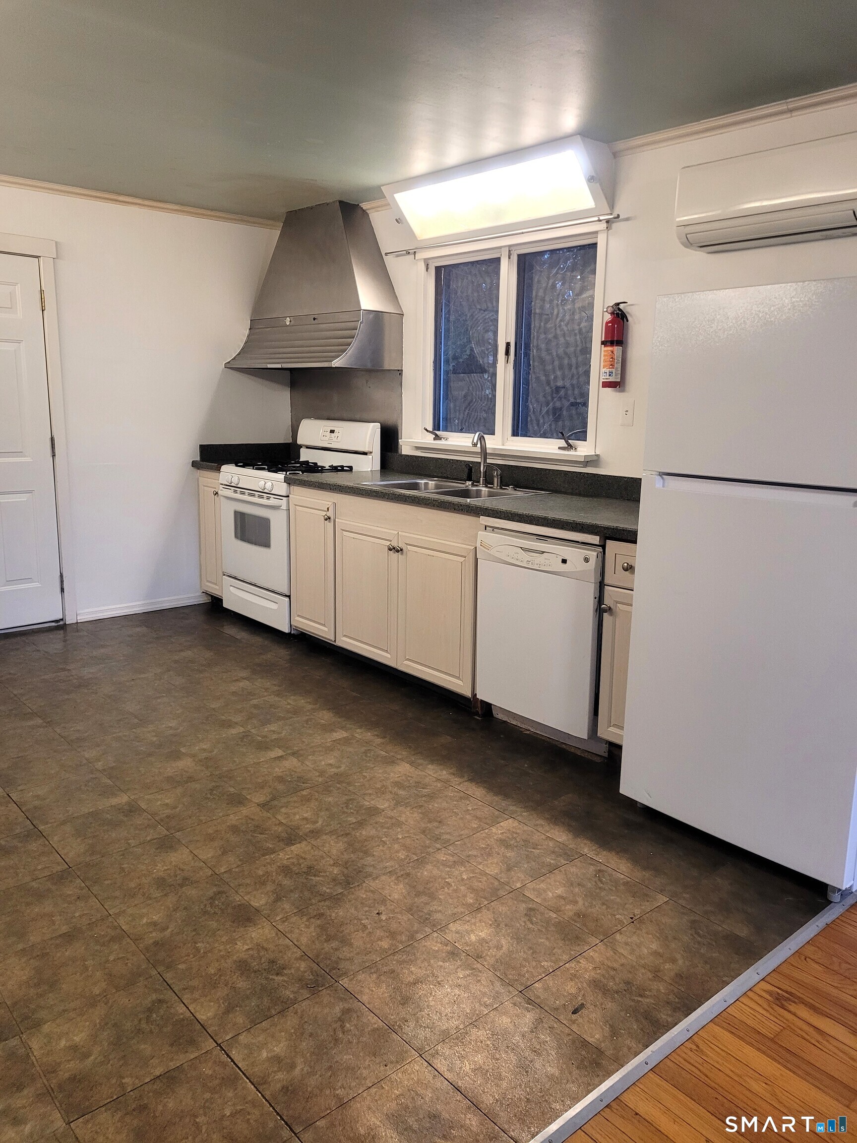 123 Bridge Street Groton, CT 06340 - Photo 4 of 22 a kitchen with granite countertop a sink and a stove