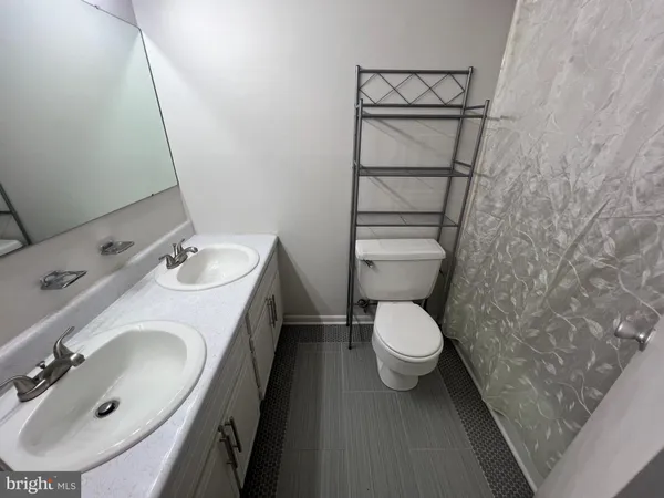 a bathroom with a tub and a shower