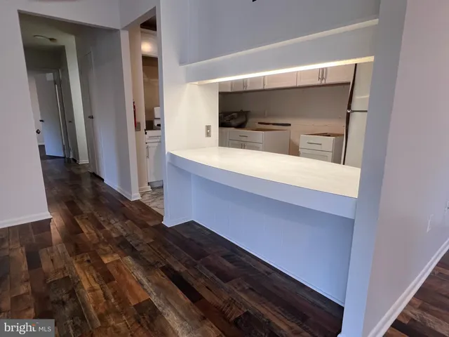 a view of bathroom with a sink and mirror