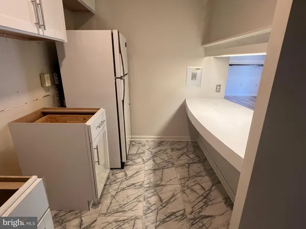 a kitchen with a stove and a cabinet