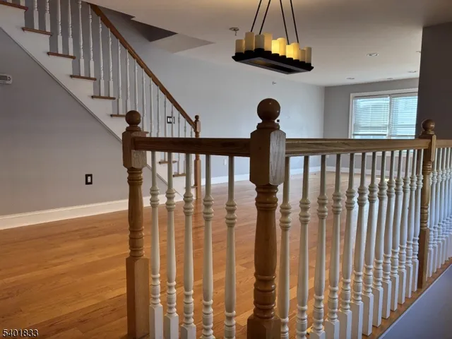 a view of a livingroom with wooden floor and a window