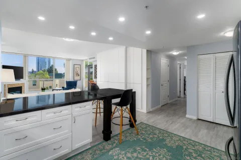 a kitchen with counter top space cabinets and stainless steel appliances