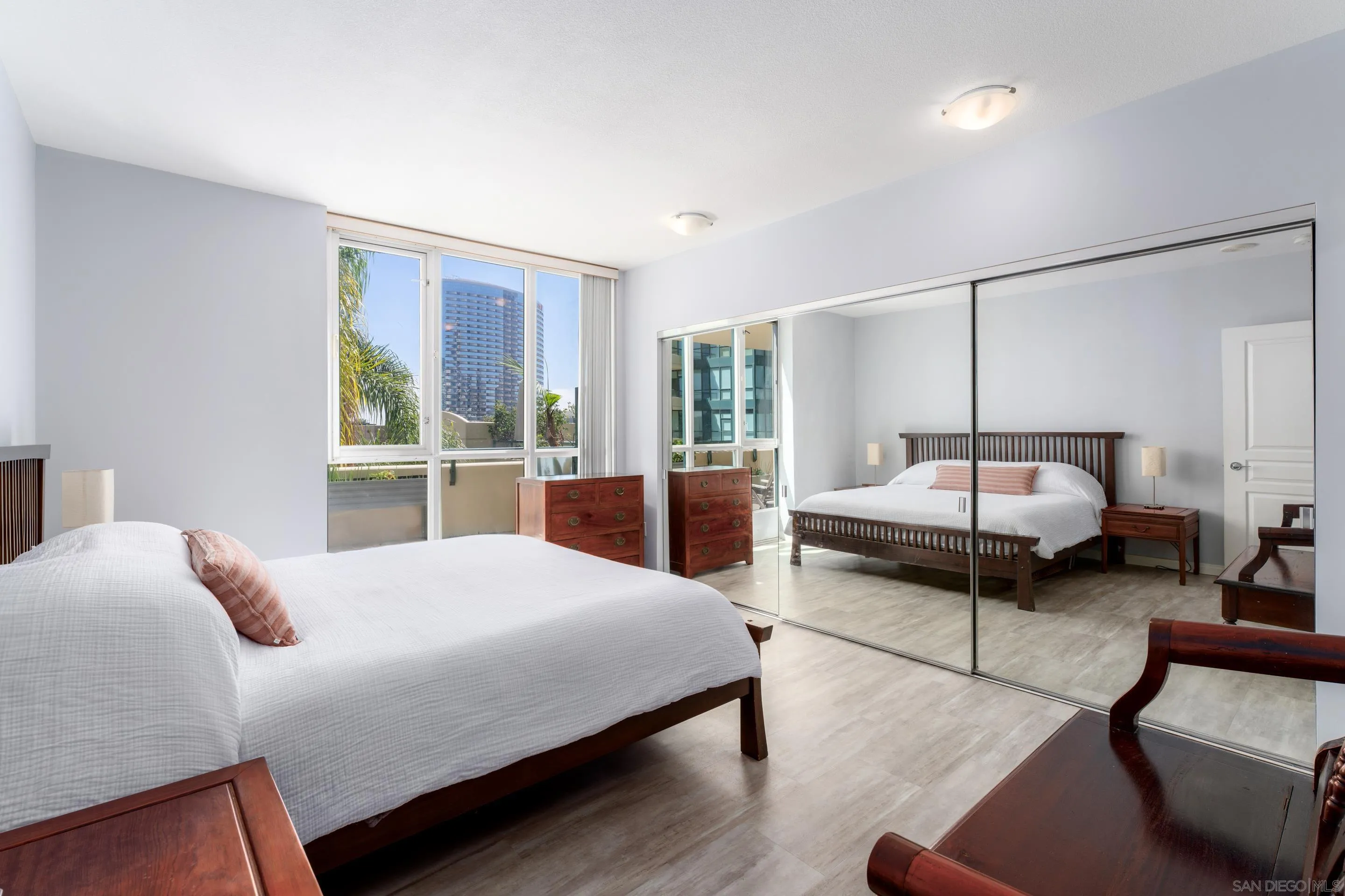 555 Front Street, Unit 303 San Diego, CA 92101 - Photo 13 of 35 a bedroom with a bed and window