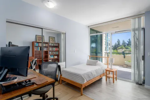 a bedroom with a bed and a bookshelf